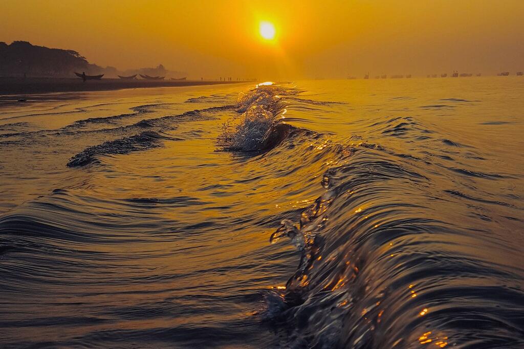 The sun sets on Kuakata beach in Bangladesh.